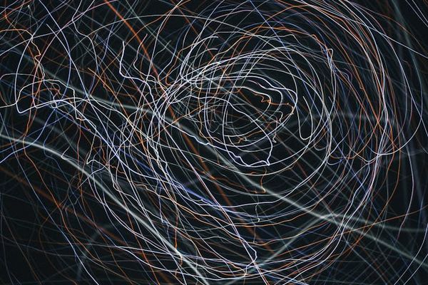 Abstract light trails suggesting smooth movement and flow.